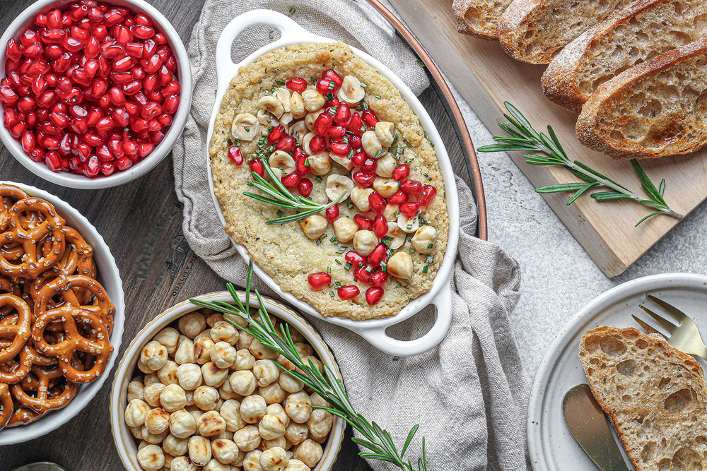 Baked Goat Cheese with Hazelnuts, Pomegranate & Rosemary