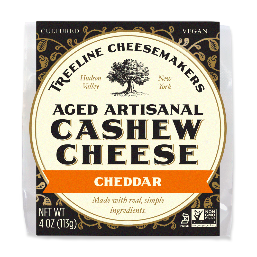 Cream & Black packaging for Treeline Cheddar Aged Artisanal Cheese Wheel