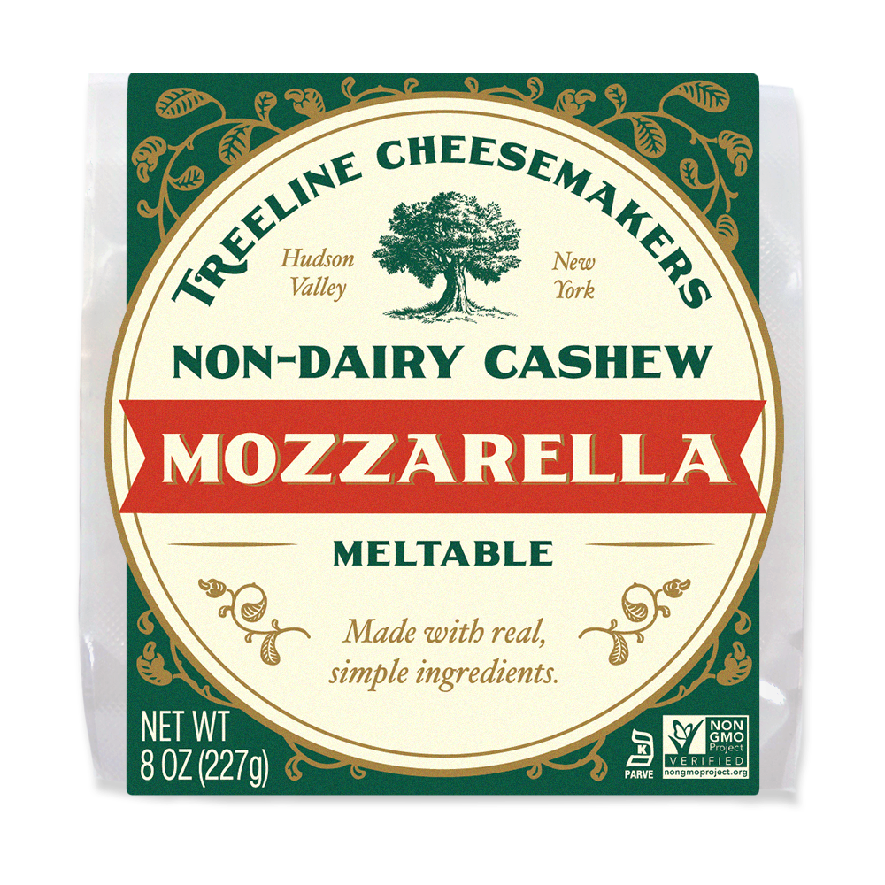 a green and cream package of Treeline Non-Dairy Cashew Mozzarella Block